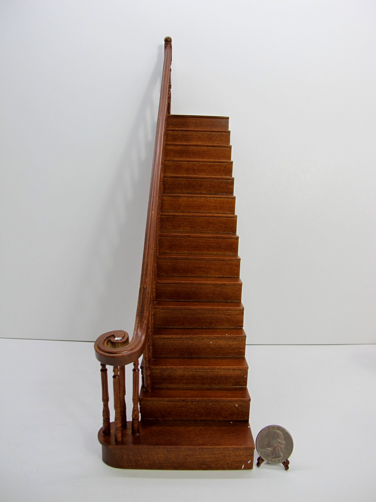 1" Scale left carved straight staircase finished in walnut